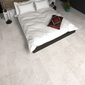 White granite tile effect laminate flooring in room shot with bed