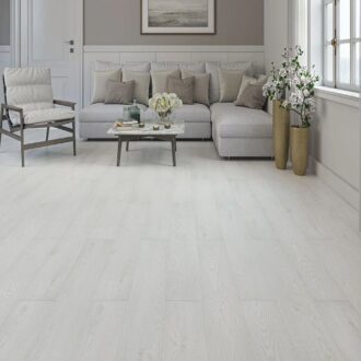 Light-colored laminate flooring with a smooth finish in a modern interior setting.