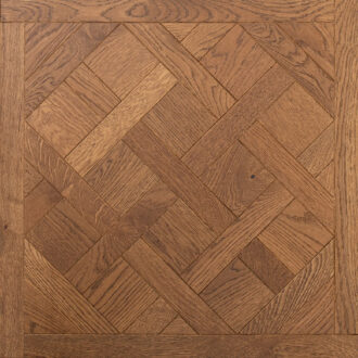 Warm oak planks form a basket weave parquet pattern, with rich grain lines and darker border strips creating a classic geometric floor design.